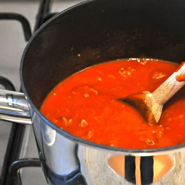Simmering the sauce for low calorie lasagne