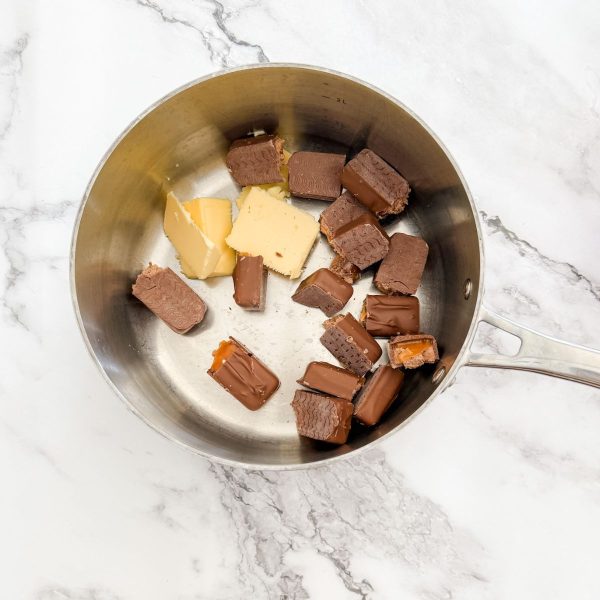 Mars bars and butter in saucepan for mars bar slice