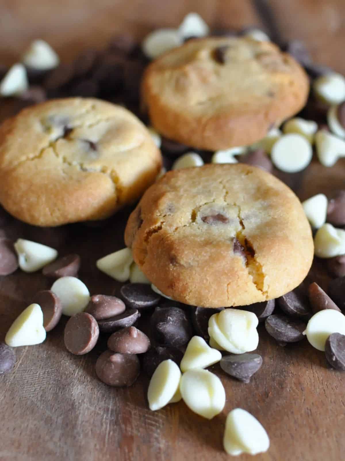New Zealand Sante biscuits - chocolate chip sante cookies on bed of chocolate chips from Edmond's cook book with white chocolate chips
