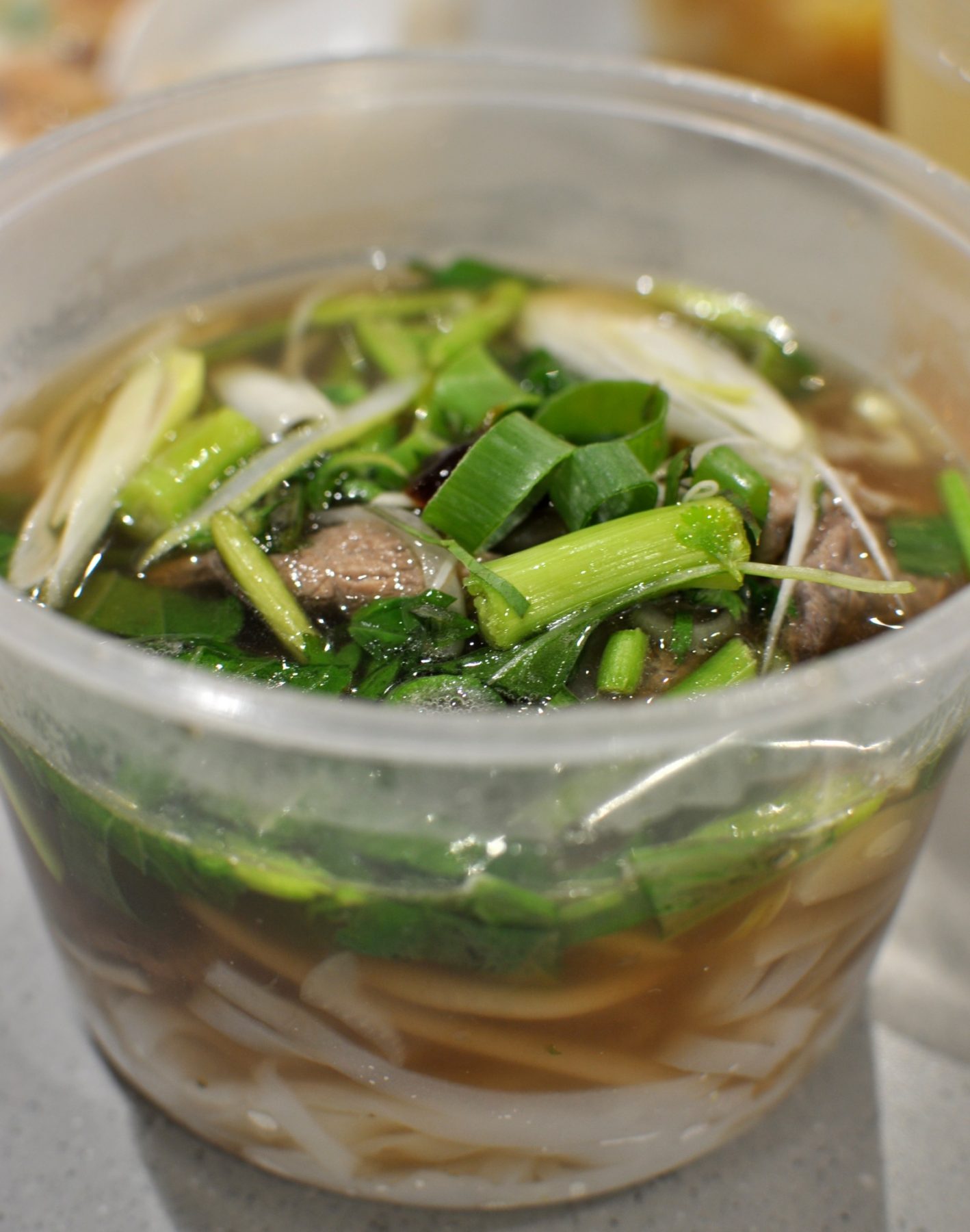 Beef Pho with thick rice noodles, tasty beef soup and fresh basil