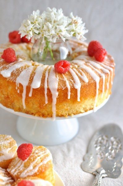 Vanilla almond cake with lemon drizzle and raspberries