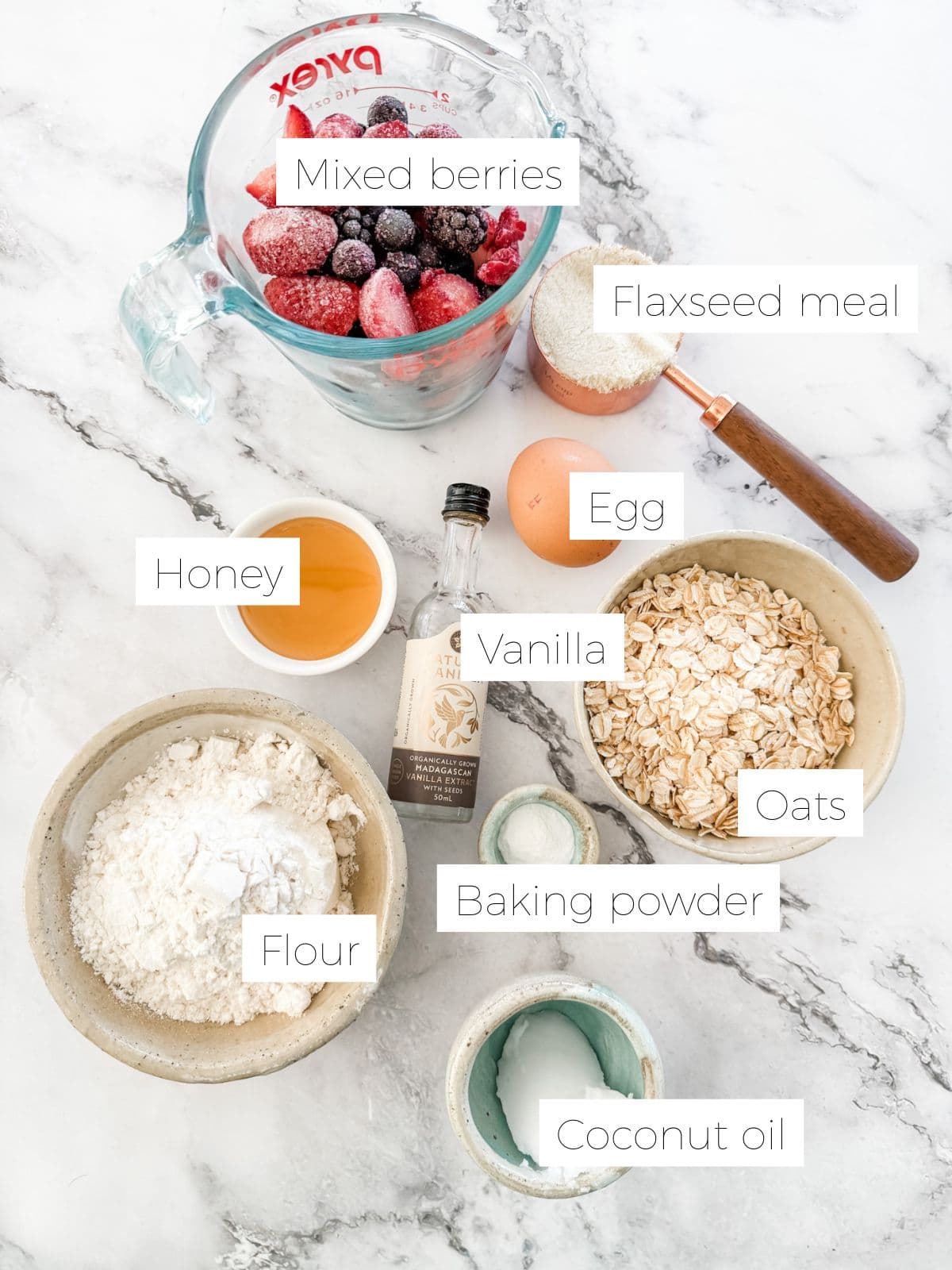 Ingredients for Berry Breakfast Bars - Bowl of berries, flour, an egg, honey, vanilla.
