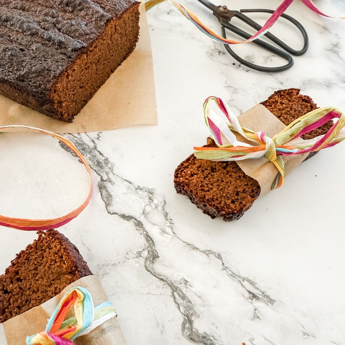 Gluten-Free Gingerbread Loaf Cake - sliced & with ribbons.