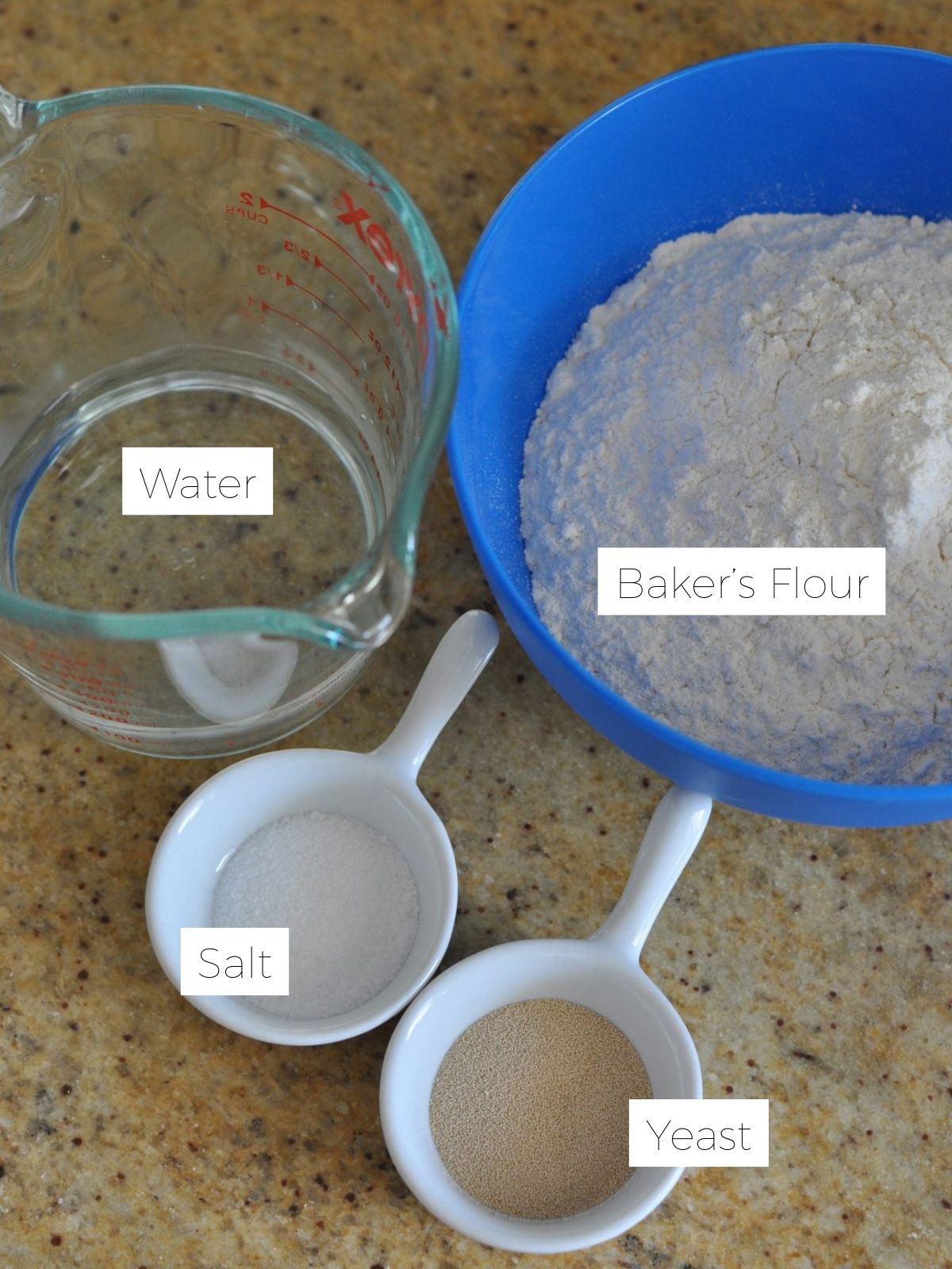 Ingredients for Turkish bread - bowl of flour, yeast and salt and jug of water. 