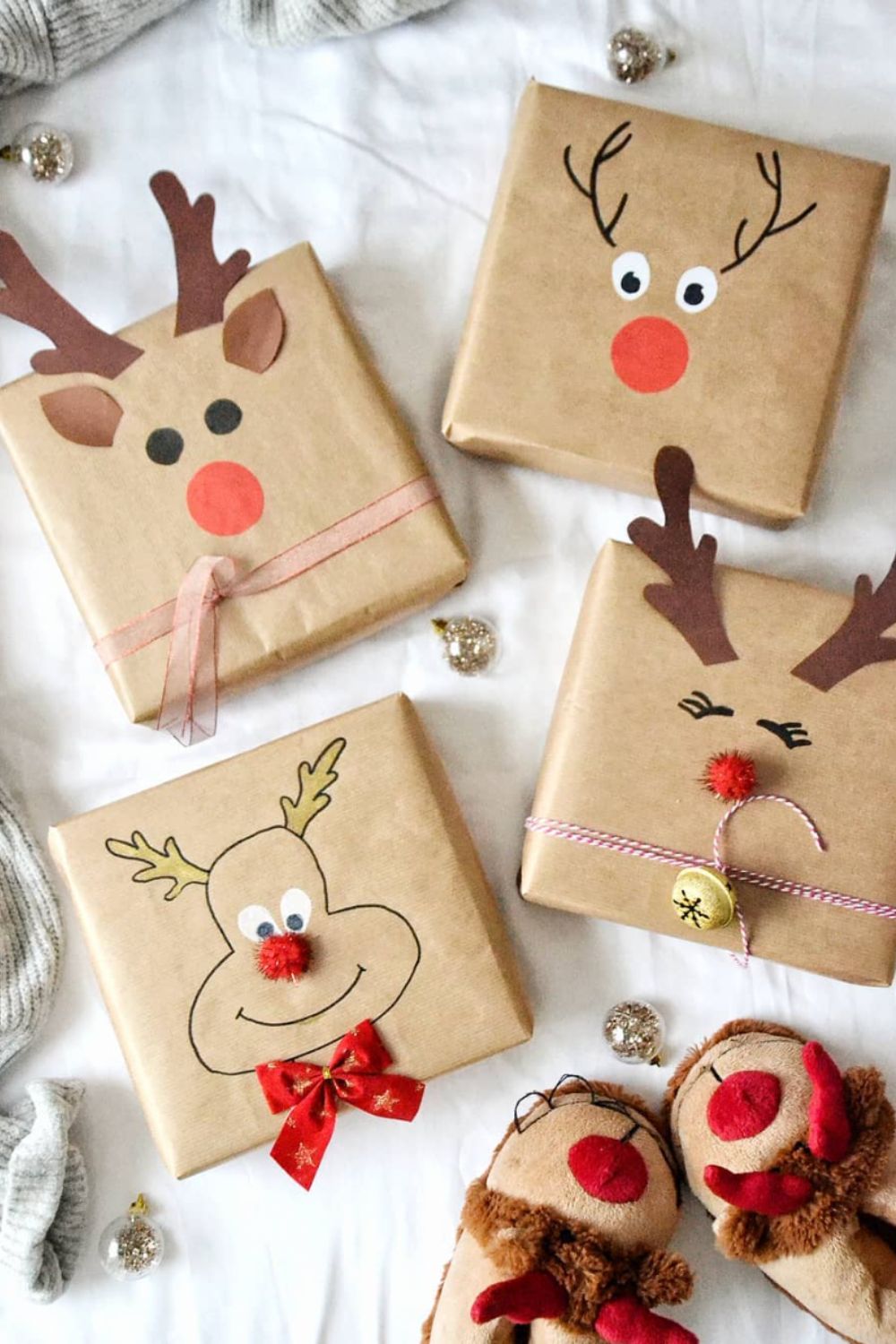 Reindeer faces on brown paper wrapped Christmas gifts