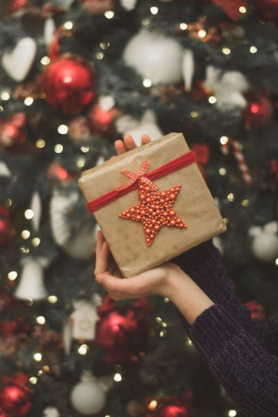 Christmas present wrapped with brown paper and finished with an ornament