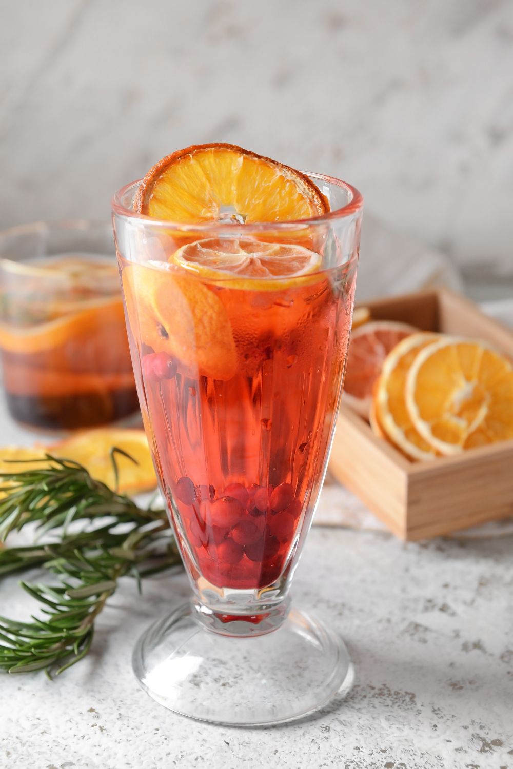 Cocktail decorated with a dried orange slice for Christmas