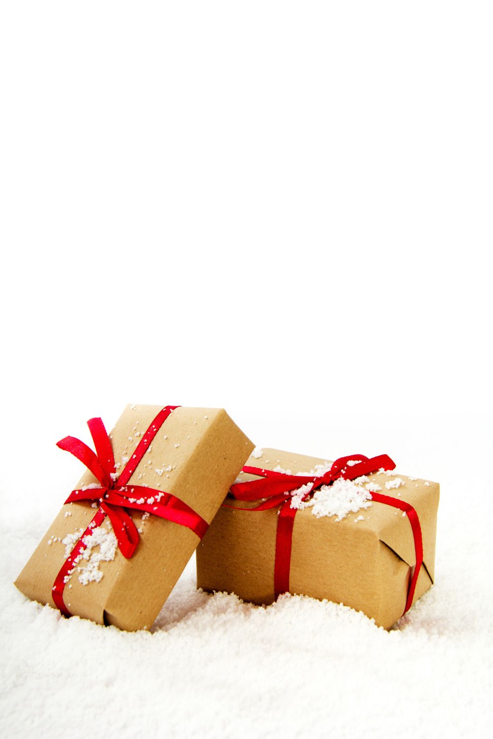 Coloured ribbon on brown paper Christmas gifts