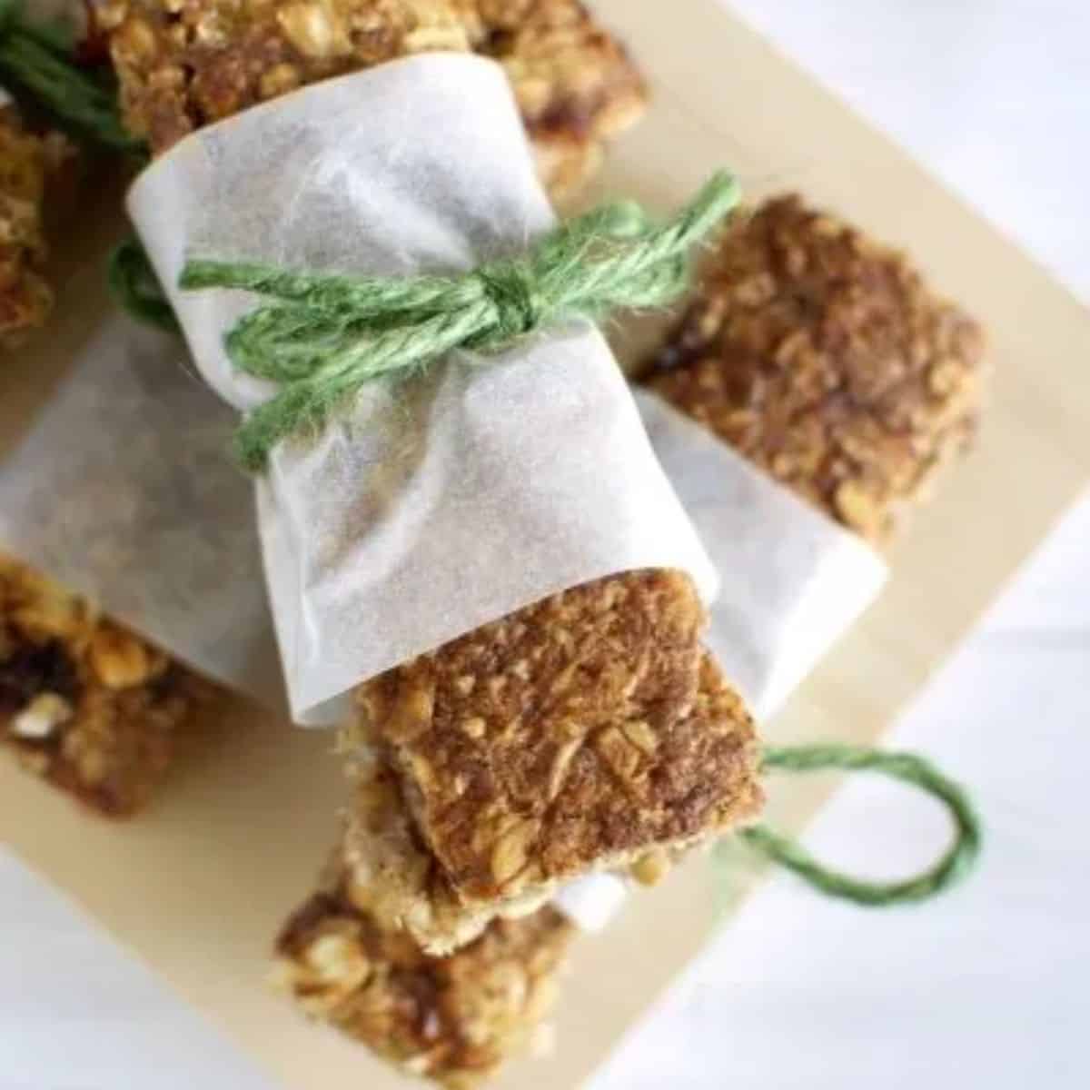 Banana muesli bars with a baking paper wrap tied with green string