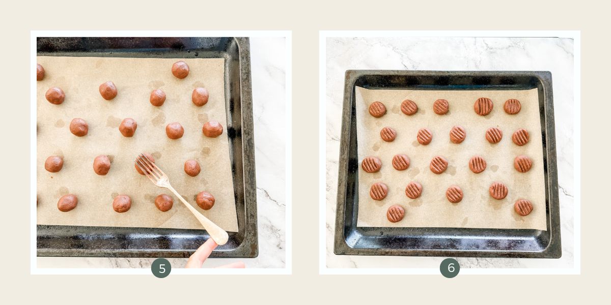 A fork pressing into balls of chocolate shortbread dough on lined baking tray. 