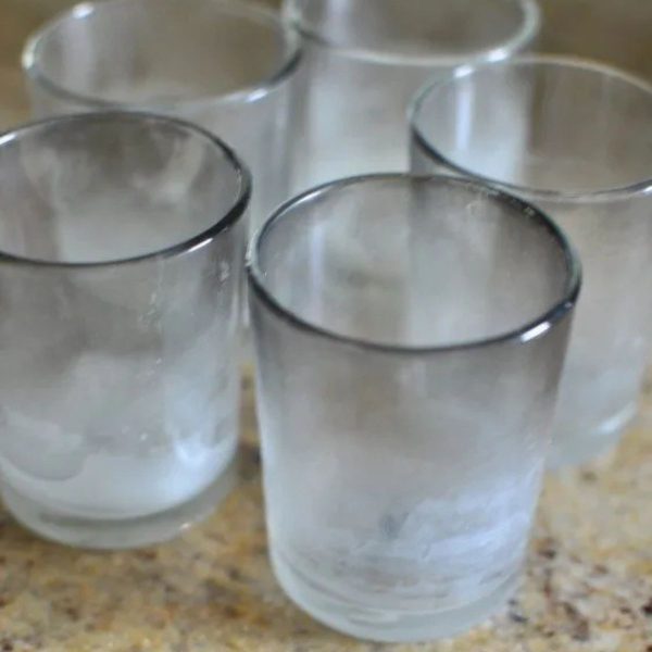 Dirty used glass candle holders
