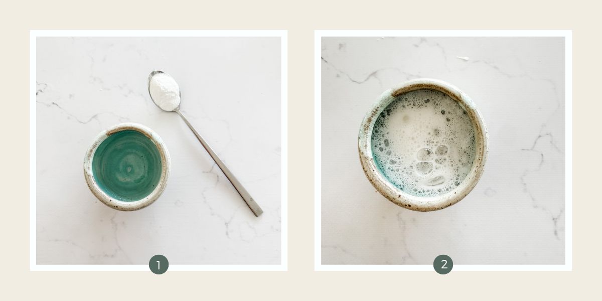 Baking powder and water on white marble backdrop.