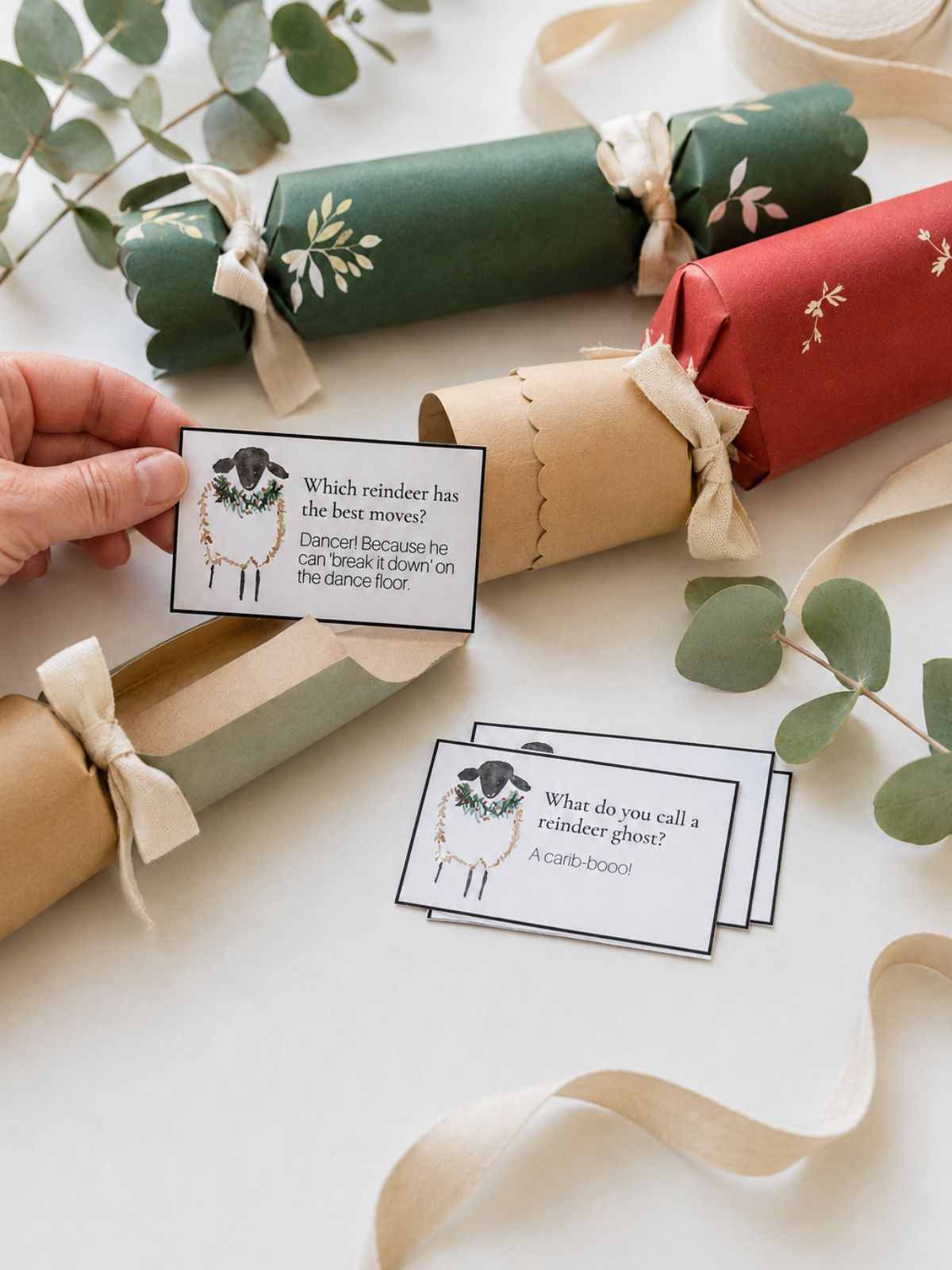 Christmas cracker joke held in front of Christmas cracker