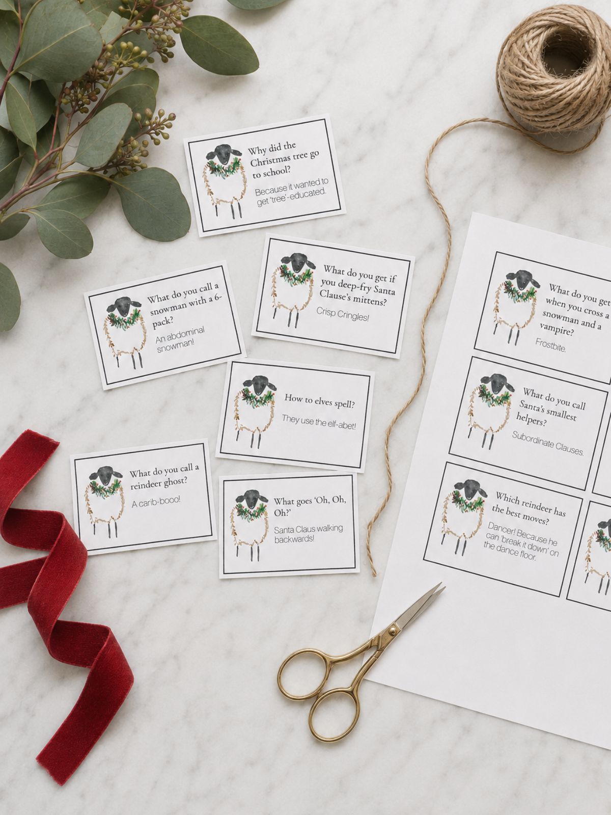 Printed Christmas jokes being cut up on a white bench.
