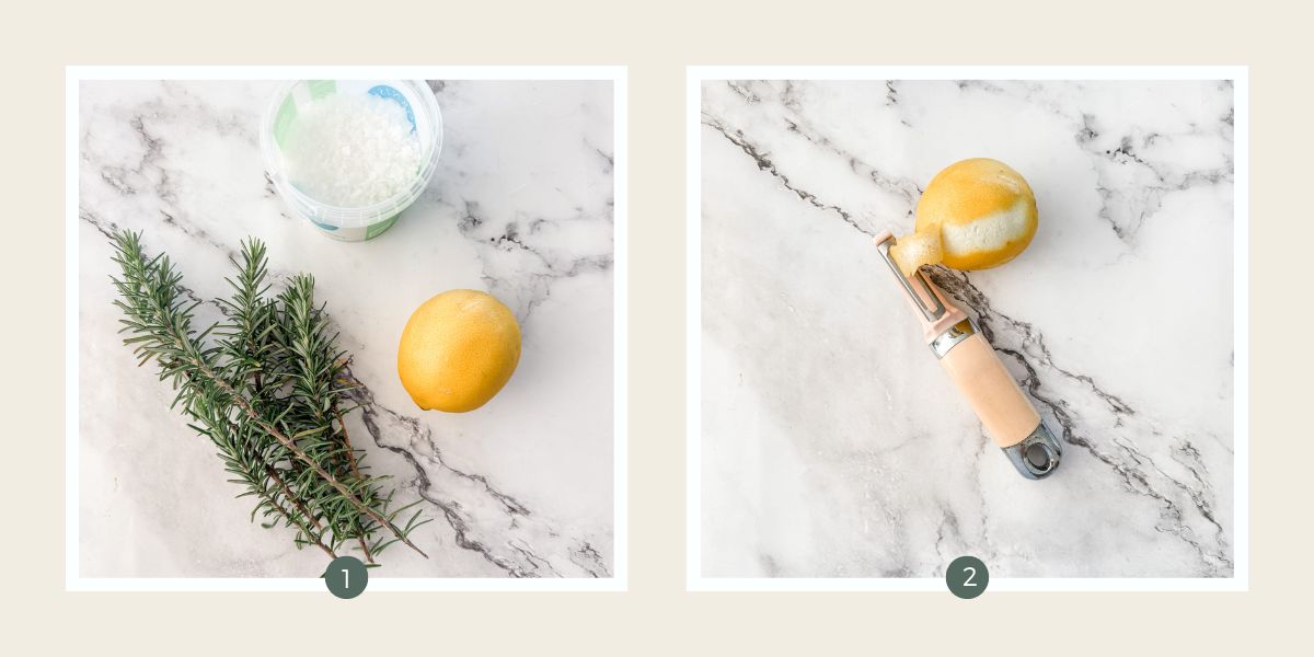 Sea salt flakes, fresh rosemary and a lemon on white marble benchtop ready to make lemon rosemary salt. And lemon being peeled. 