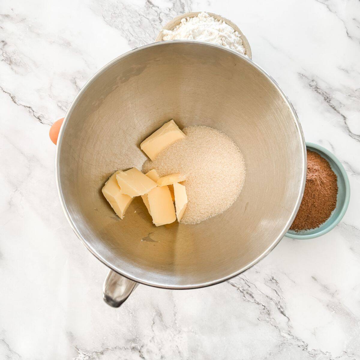 Mixing bowl with butter and sugar. 