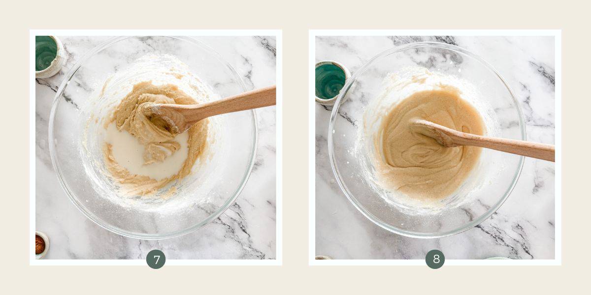 Stirring milk into cake batter in glass bowl on white marble bench.