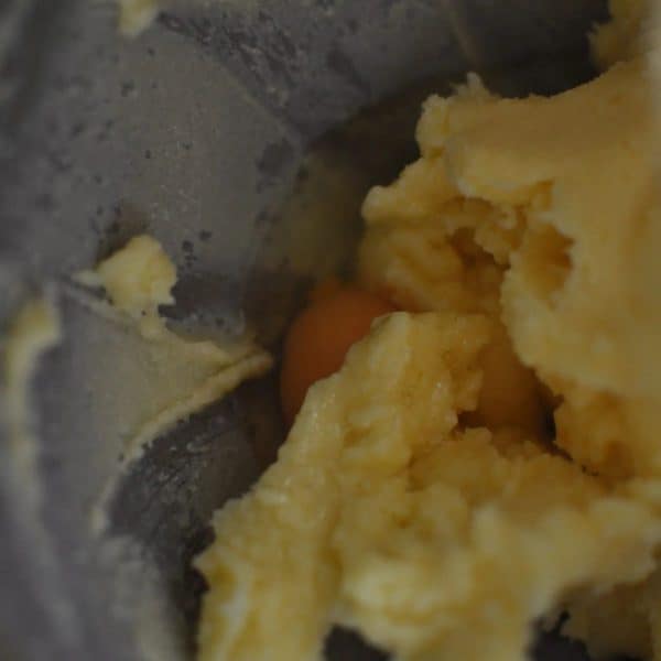 Adding egg to cake batter