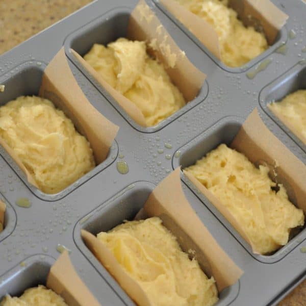 Cake batter divided between mini loaf tins