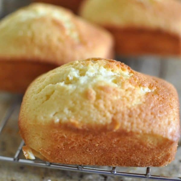 Mini lemon madeira loaf cake cooling on a cooling rack