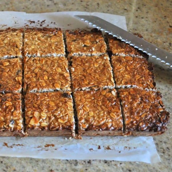 Slicing up homemade muesli bars fresh from the oven