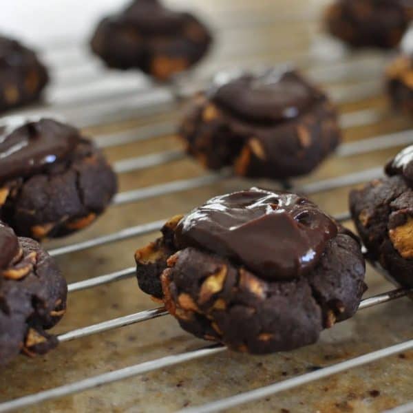 Afghan biscuits - spreading icing on cookies