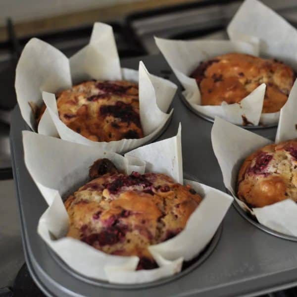 Healthy raspberry and white chocolate muffins in the tin