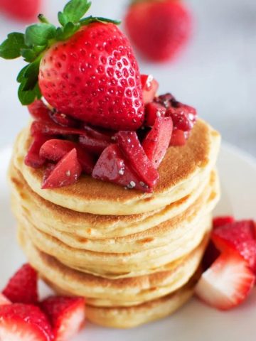 Sourdough pancakes topped with strawberries