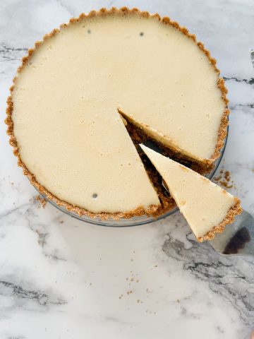 Passion fruit tart with a slice out of it
