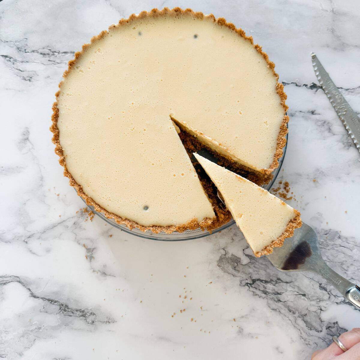 Passion fruit tart with a slice out of it