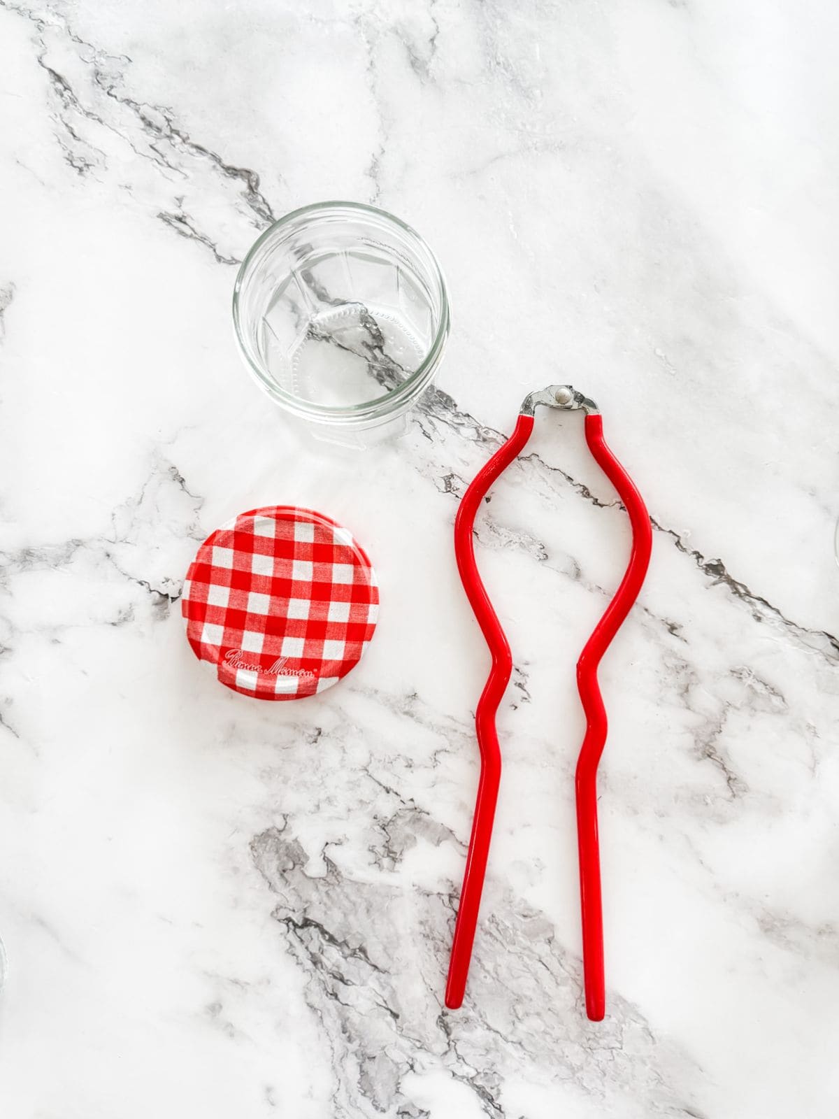 Open glass jar with jar holder