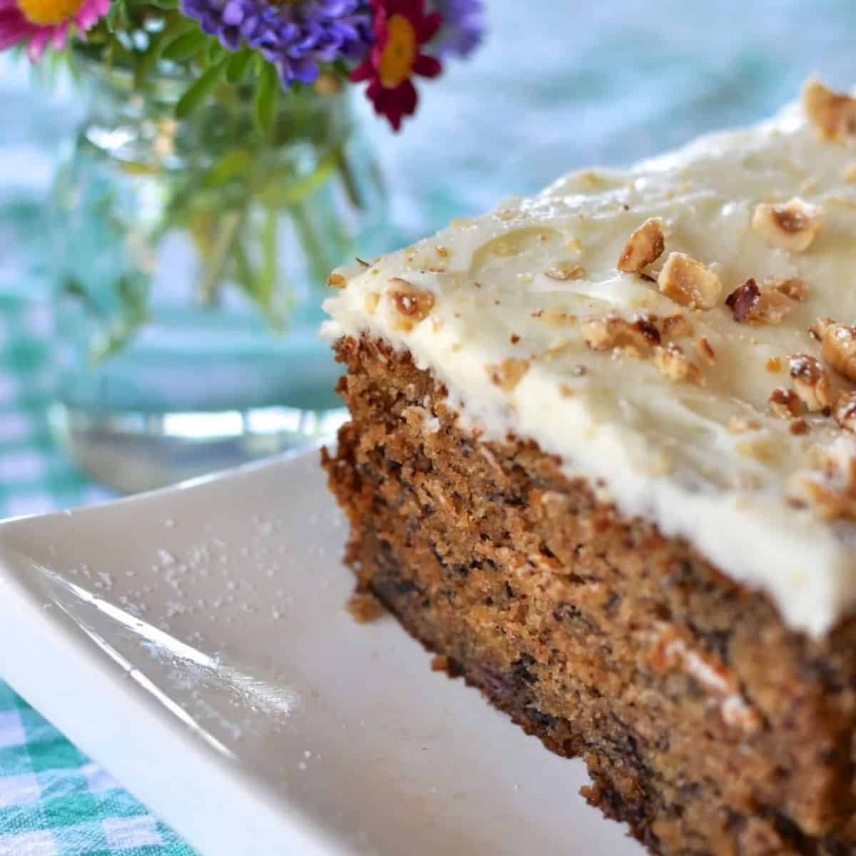 Moist, nutty, and topped with tangy cream cheese icing, this banana hazelnut cake is the ultimate way to use up ripe bananas and impress your guests.