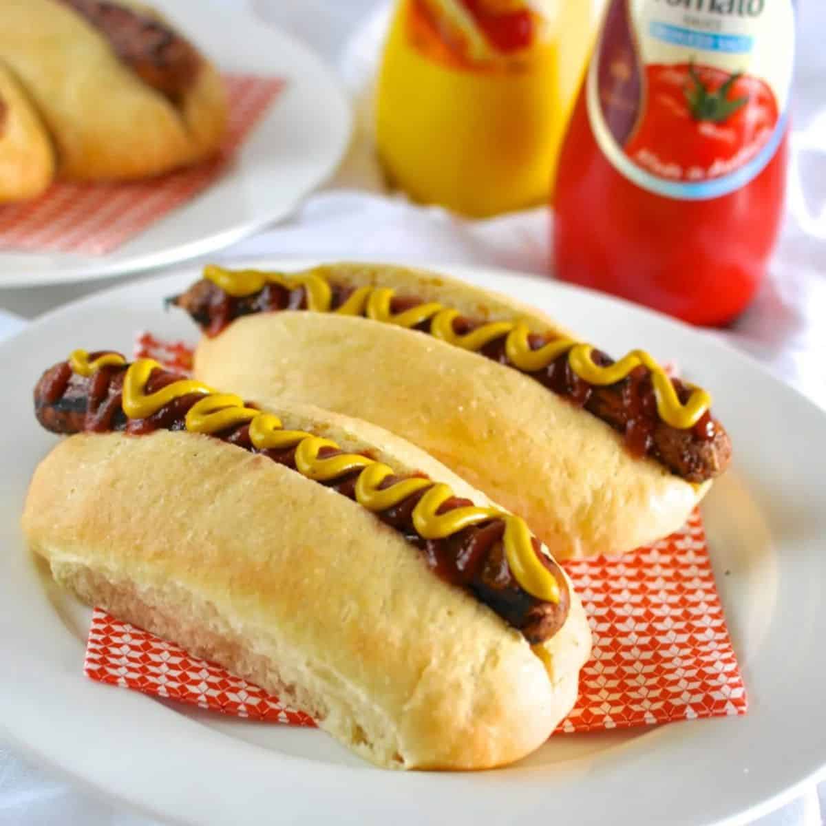 Hot dog rolls with sausages and sauce